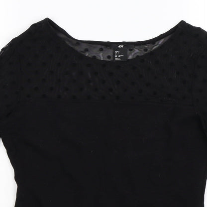 Close-up detail of H&M women’s black jumper, size S