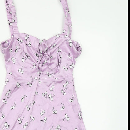 Close-up detail of Kai women’s purple a-line, size S, - cherry print