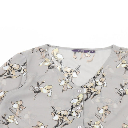 Close-up detail of Code women’s green floral basic blouse, size UK 10