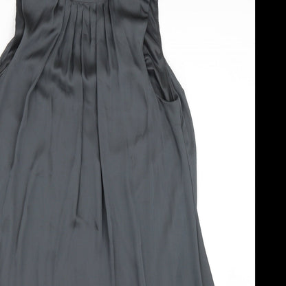 Close-up detail of women’s green satin shift, size M