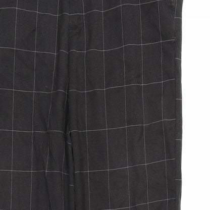 Close-up detail of Weekday men’s grey check trousers, 29-inch leg