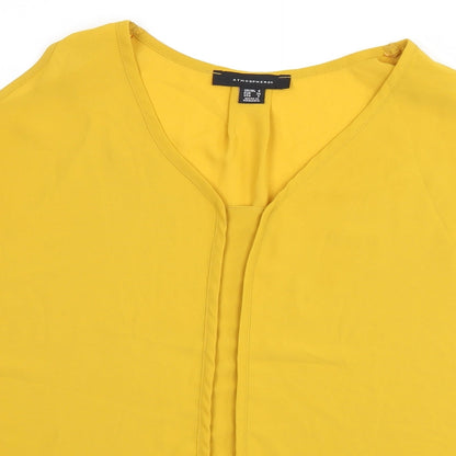 Close-up detail of Atmosphere women’s yellow basic t-shirt, size UK 6, - cut out shoulder