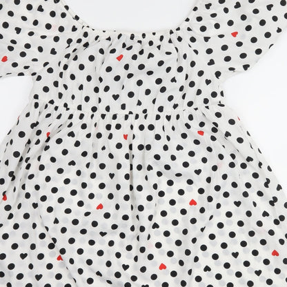Brand and care label for Wednesday's girl women’s white polka dot shift, size L