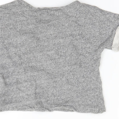 Brand and care label for Gap girls’ grey jumper, size 3-4, years