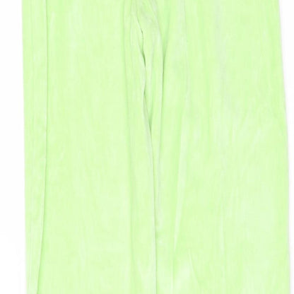 Brand and care label for PRETTYLITTLETHING women’s green fleece trousers, size UK 6, 33-inch leg - side splits