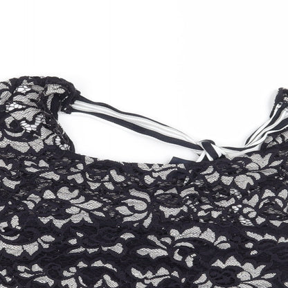 Close-up detail of Preworn women’s blue floral basic blouse, size S