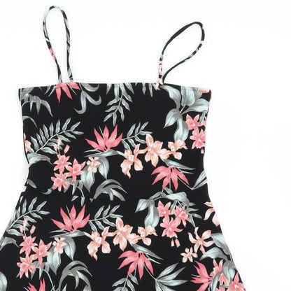 Close-up detail of H&M women’s black floral basic blouse, size UK 12