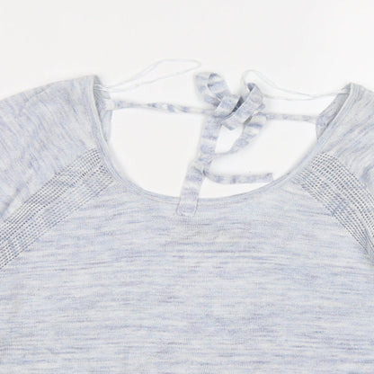 Close-up detail of Indigo women’s blue knit jumper, size UK 12