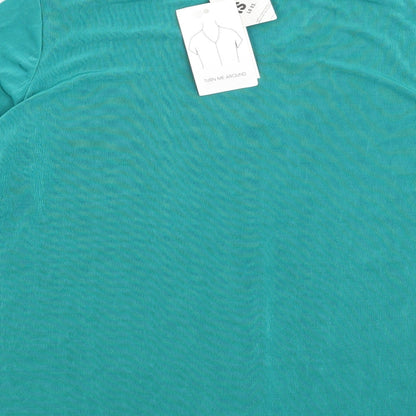 Brand and care label for Citiknits women’s green basic blouse, size M