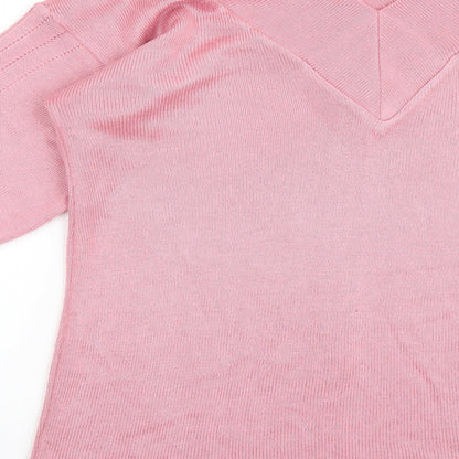 Brand and care label for Imagination women’s pink jumper, size S