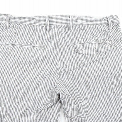 Brand and care label for River Island women’s white bermuda shorts, size UK 30