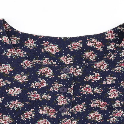 Close-up detail of Nightingales women’s blue floral basic button-up, size UK 16