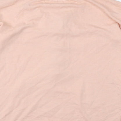 Brand and care label for Missguided women’s pink jumper, size UK 6