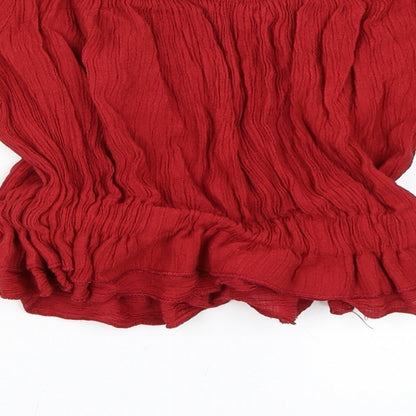 Brand and care label for Preworn women’s red cropped blouse, size S