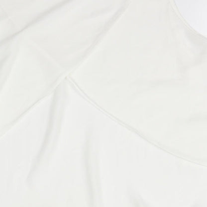 Brand and care label for Miss Selfridge women’s white basic blouse, size UK 8