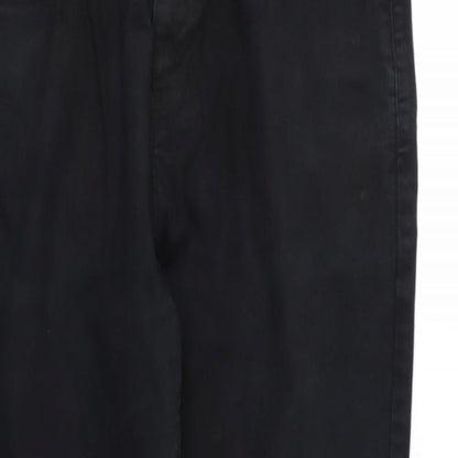 Close-up detail of Next women’s black denim tapered jeans, size UK 34, 31-inch leg