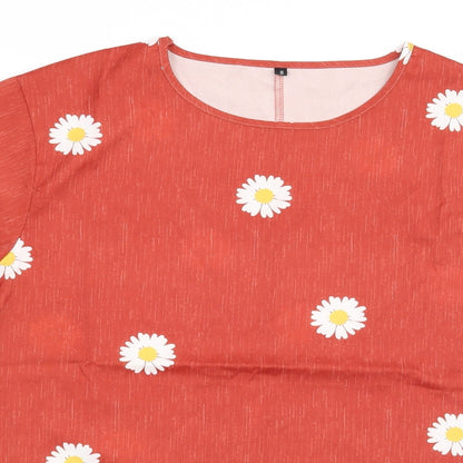 Close-up detail of Preworn women’s orange floral basic blouse, size S