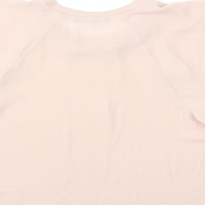 Brand and care label for Atmosphere women’s pink basic blouse, size UK 10