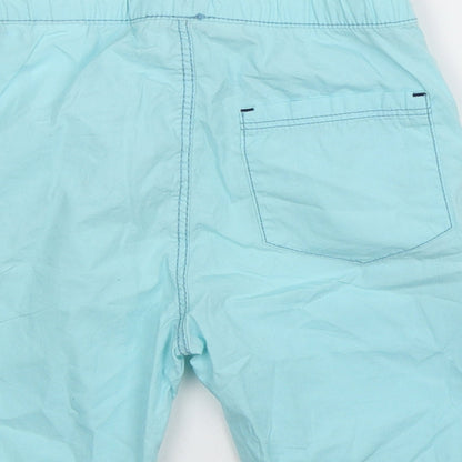 Brand and care label for H&M boys’ blue bermuda shorts, size 4-5, years