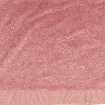 Brand and care label for Topshop women’s pink jumper, size UK 12