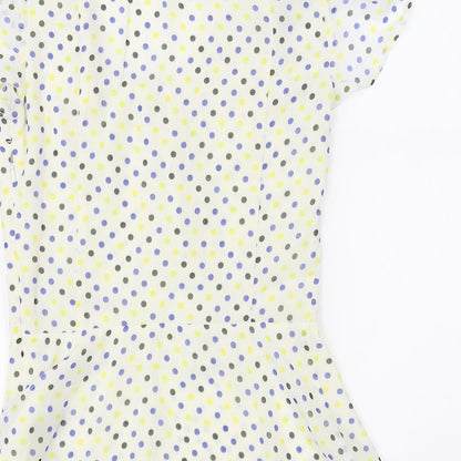 Brand and care label for Pepperberry women’s ivory polka dot basic blouse, size UK 8