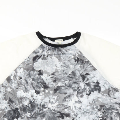 Close-up detail of River Island women’s grey floral basic blouse, size UK 10, - open sides