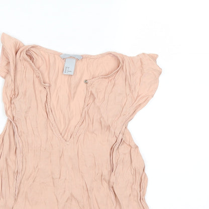 Close-up detail of H&M women’s pink basic blouse, size UK 6