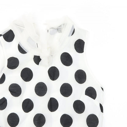 Close-up detail of Coast women’s white polka dot basic blouse, size UK 10