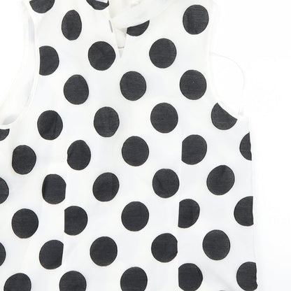 Brand and care label for Coast women’s white polka dot basic blouse, size UK 10