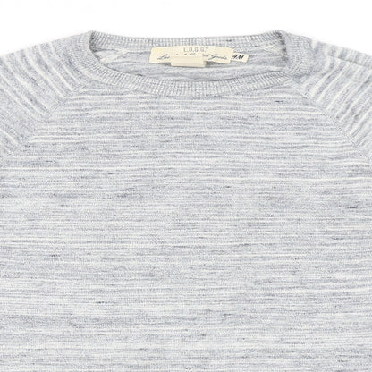 Close-up detail of H&M men’s blue jumper, size S