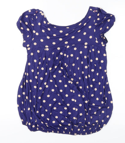 Back view of Vintage women’s blue polka dot basic blouse, size UK 8