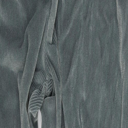 Close-up detail of Accent women’s green trousers, size M, 27-inch leg
