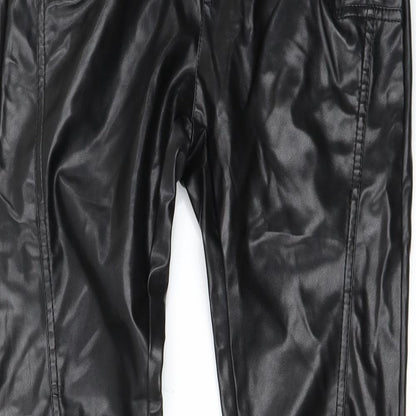 Close-up detail of Preworn women’s black trousers, size M, 30-inch leg