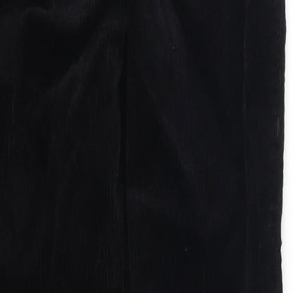 Brand and care label for Topshop women’s black corduroy trousers, size UK 25, in, 25-inch leg