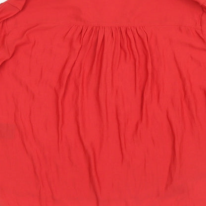Brand and care label for H&M women’s red mesh basic blouse, size UK 6