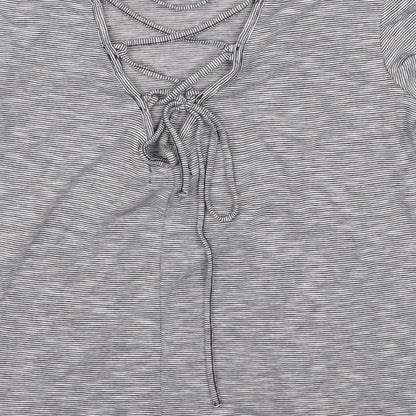 Brand and care label for H&M women’s grey striped basic t-shirt, size M
