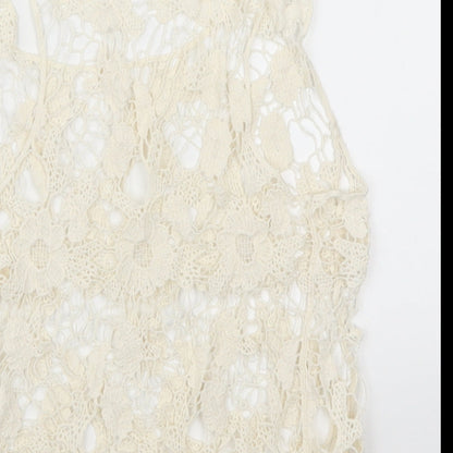 Brand and care label for Atmosphere women’s beige floral lace basic tank, size XS
