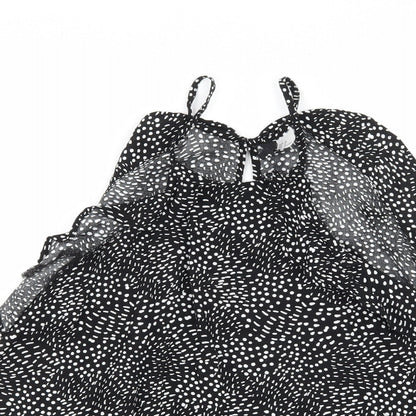 Close-up detail of H&M women’s black polka dot camisole tank, size UK 12