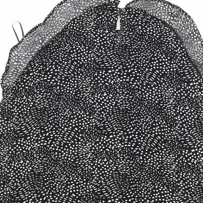 Brand and care label for H&M women’s black polka dot camisole tank, size UK 12