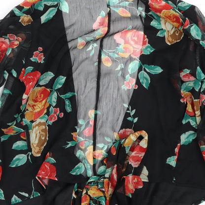 Brand and care label for Miss Selfridge women’s black floral basic blouse, size UK 6