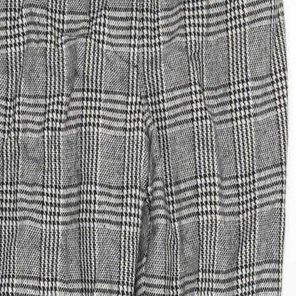 Close-up detail of Forever 21 women’s black houndstooth trousers, size S, 25-inch leg