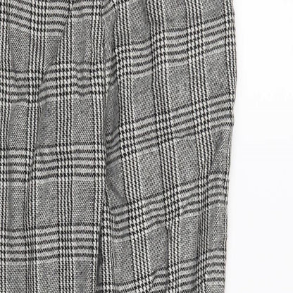 Brand and care label for Forever 21 women’s black houndstooth trousers, size S, 25-inch leg
