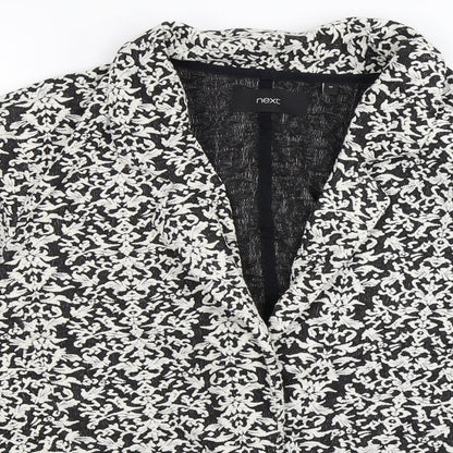 Close-up detail of Next women’s black floral jacket, size UK 16