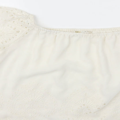 Brand and care label for Miss Selfridge women’s white basic blouse, size UK 10