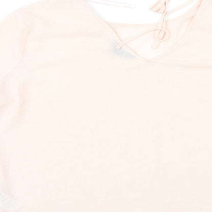Brand and care label for New Look women’s orange tunic blouse, size UK 14