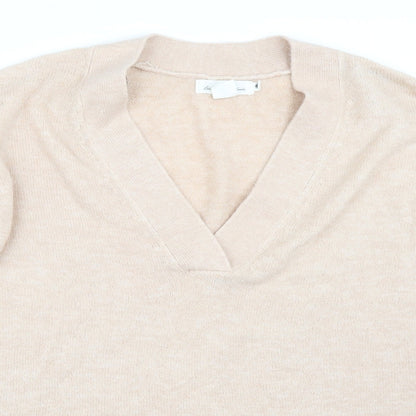 Close-up detail of H&M women’s pink jumper, size S