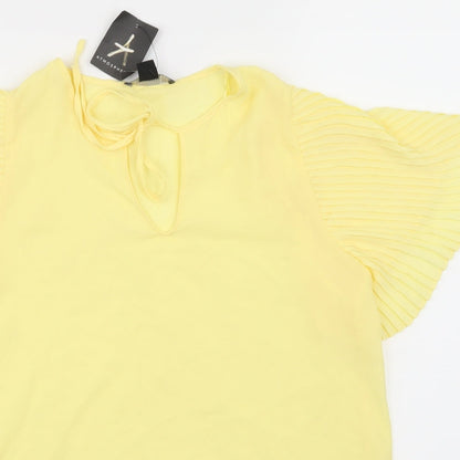 Close-up detail of Primark women’s yellow basic blouse, size UK 10