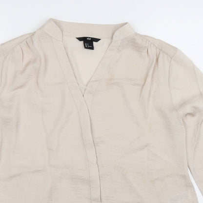 Close-up detail of H&M women’s silver basic button-up, size UK 8
