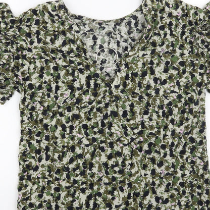 Brand and care label for Nutmeg women’s green floral basic t-shirt, size UK 8