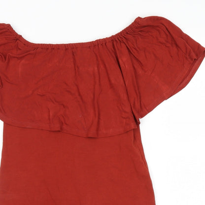 Close-up detail of Miss Selfridge women’s orange basic blouse, size UK 10